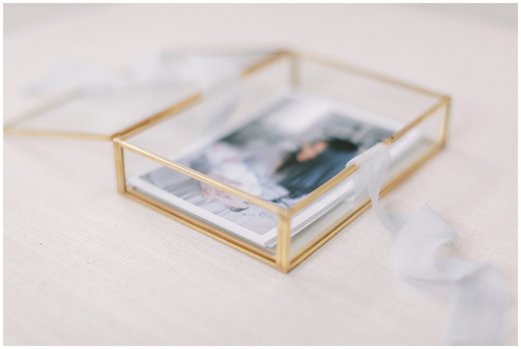 Photographs In A Gold, Glass Box With Light Blue Ribbon For Dc Fine Art Photographer Marie Elizabeth Photography