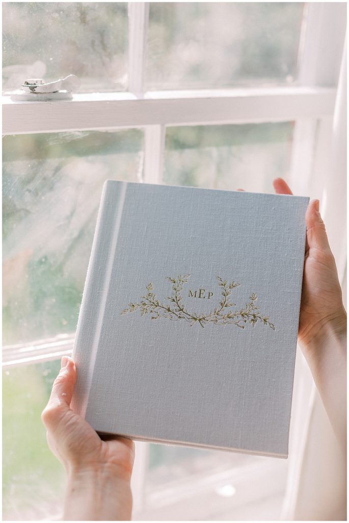 Linen Album Held Up To A Window 