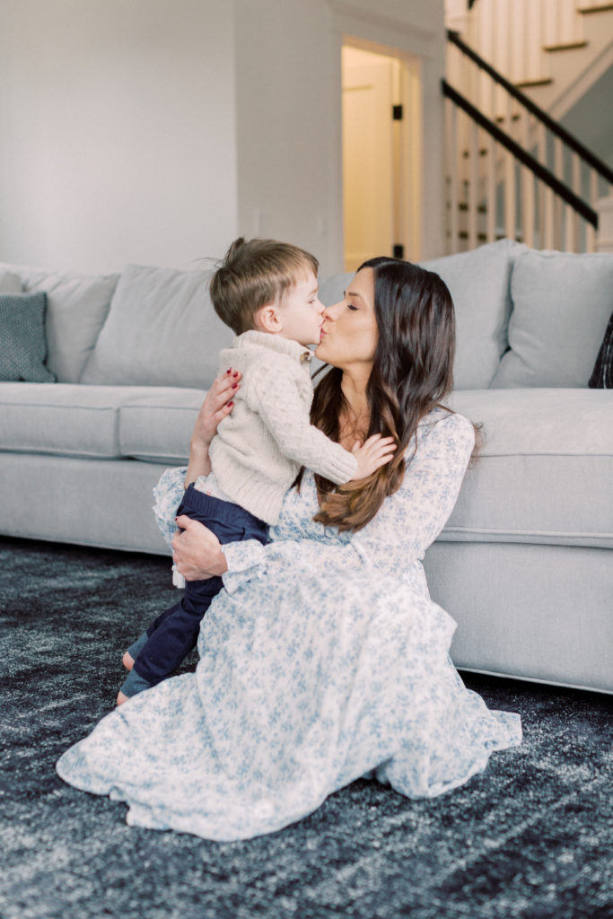 Mother Kisses Her Son During Arlington Newborn Session.