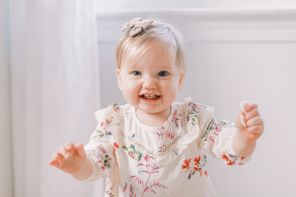 A Toddler Girl Smiling At The Camera During Her Dc Photo Session