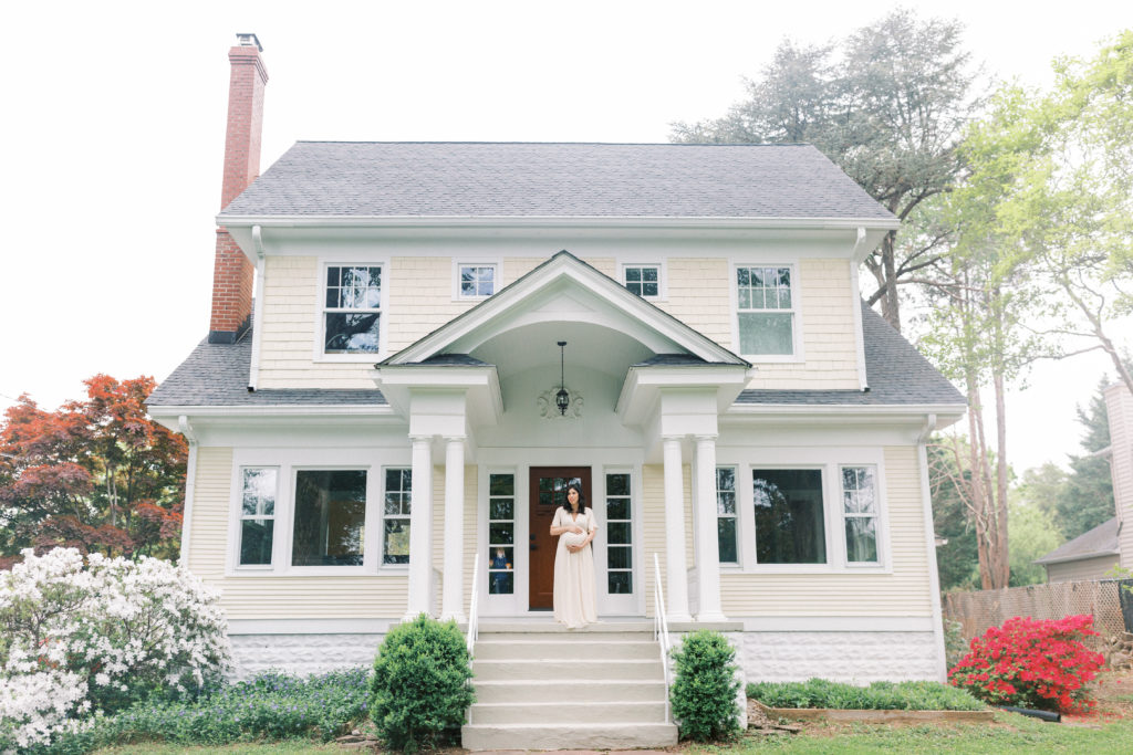 A Pregnant Woman Standing On A Porch During A Northern Virginia Maternity Session.