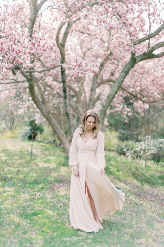 A Mom Dances In A Field Of Flowers.