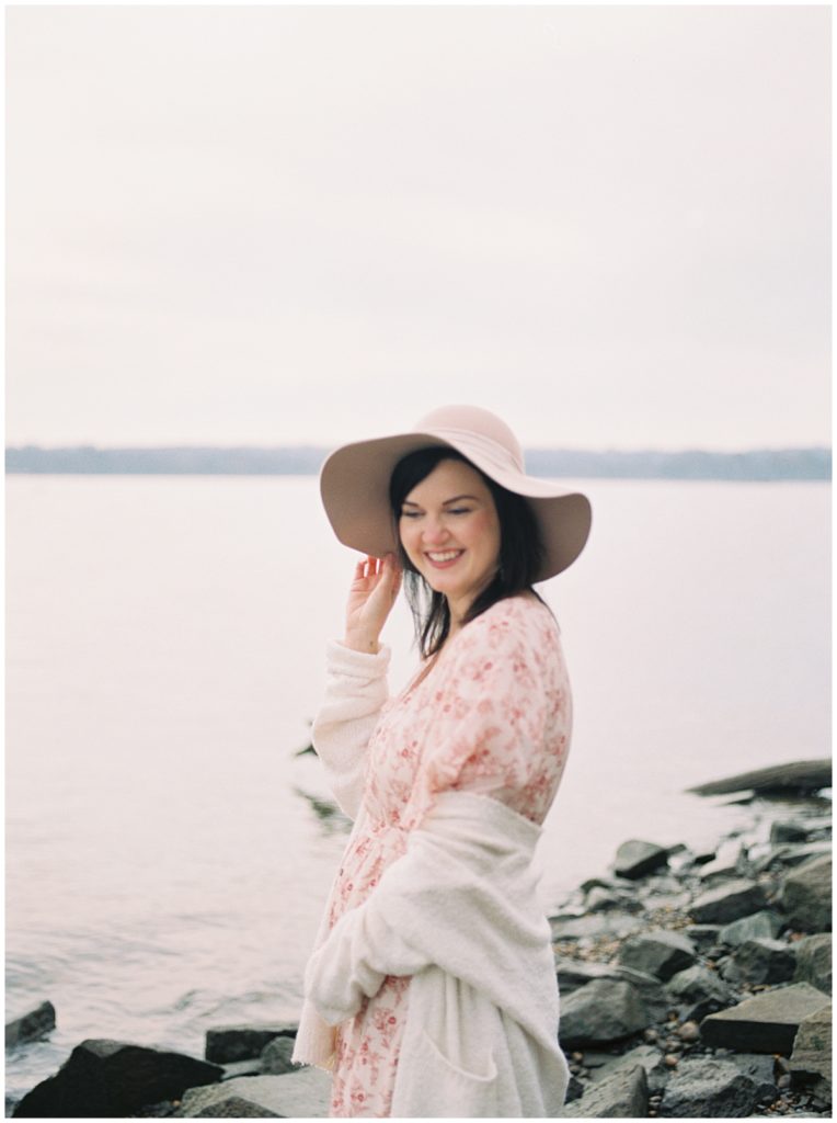 A Pregnant Mother Laughing During Her Arlington Maternity Photo Session.