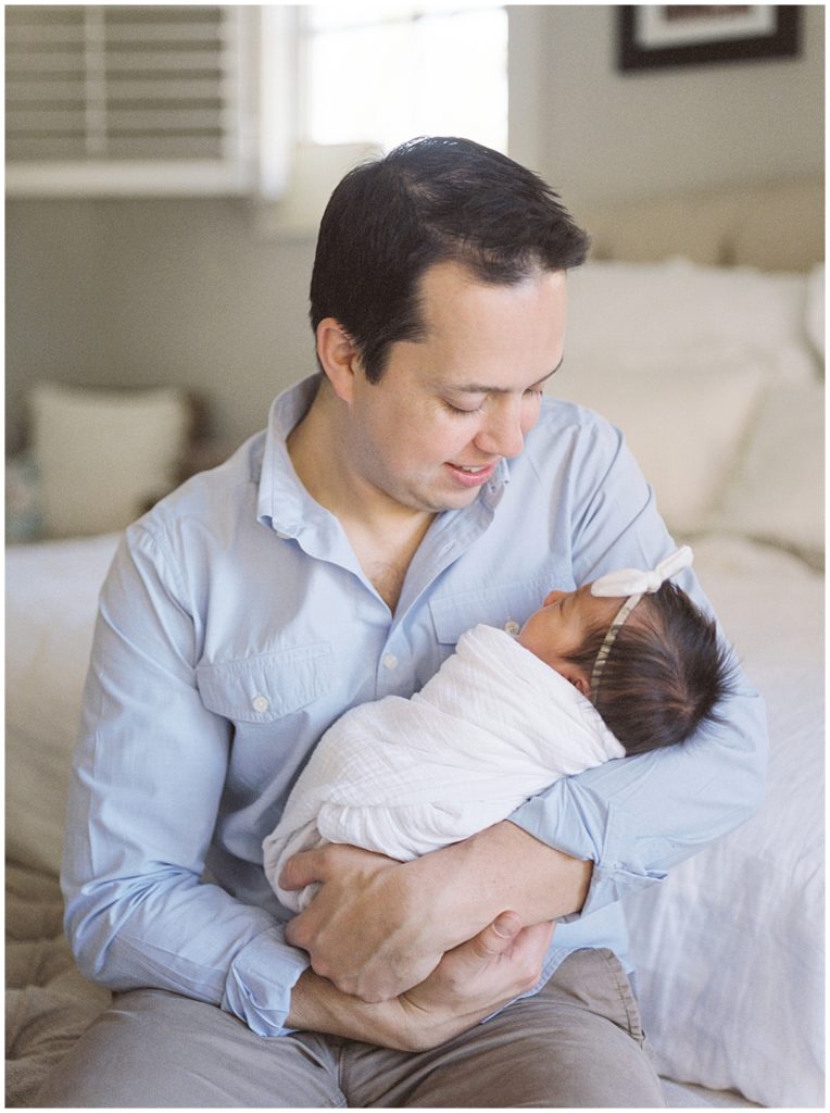 New Dad Holds Baby Girl