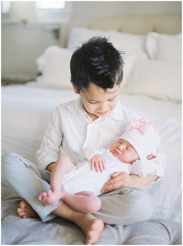 Big Brother Holds New Baby Sister