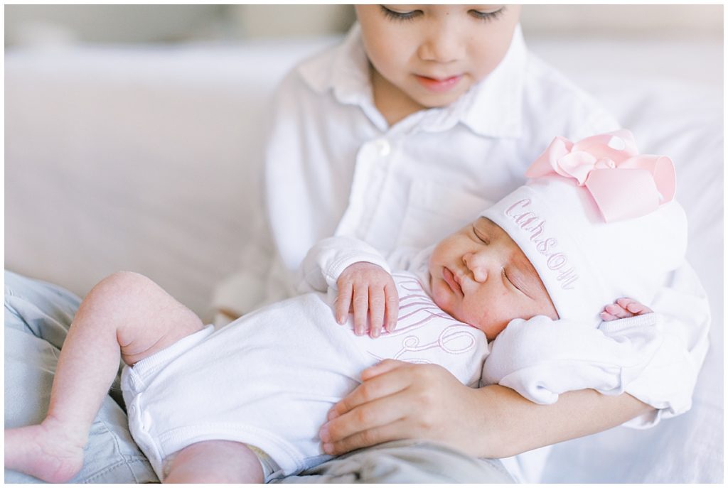 Mclean Newborn Photographer - Big Brother Holds Baby Sister