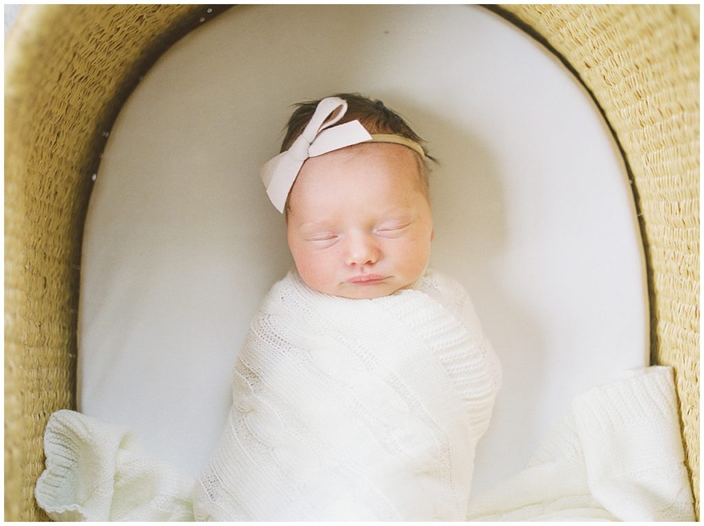 Baby Sleeps In A Moses Basket