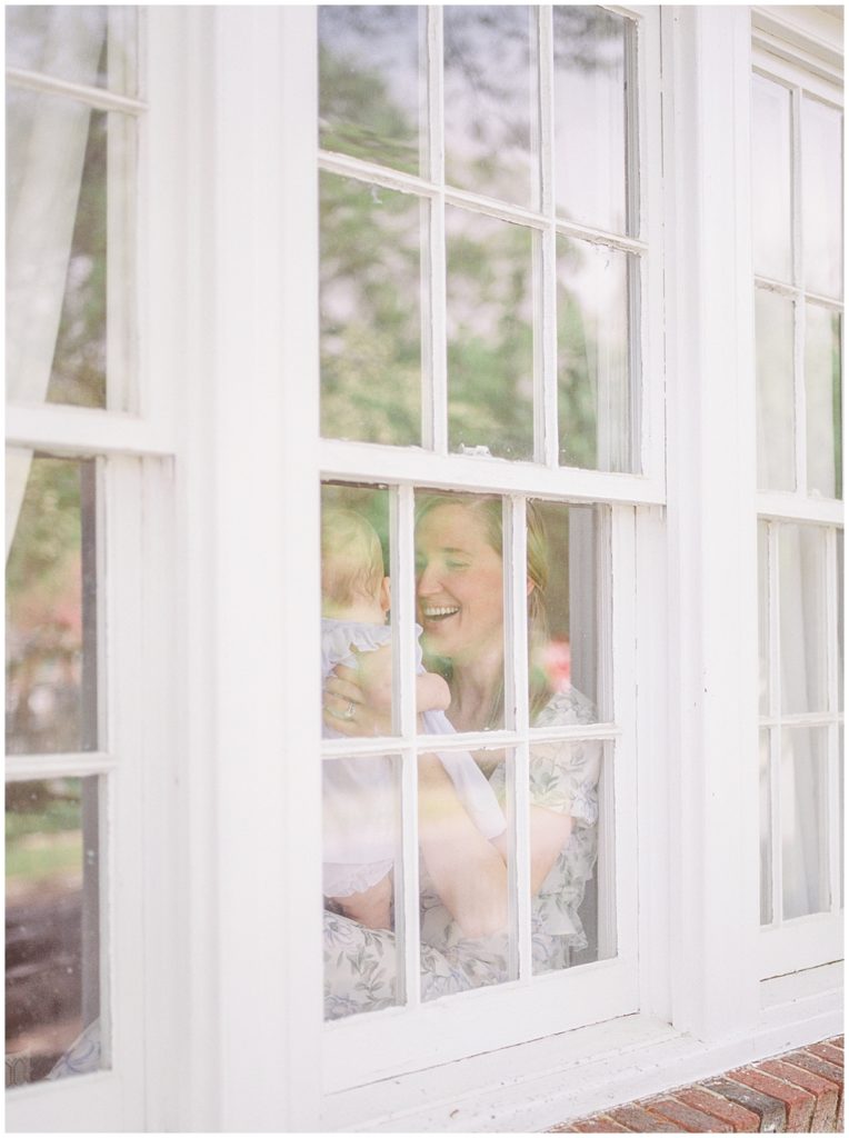 Mother And Baby In A Window