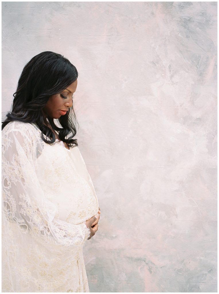 Mother With Her Hands Below Her Belly In A Studio Maternity Session In Washington, D.c.