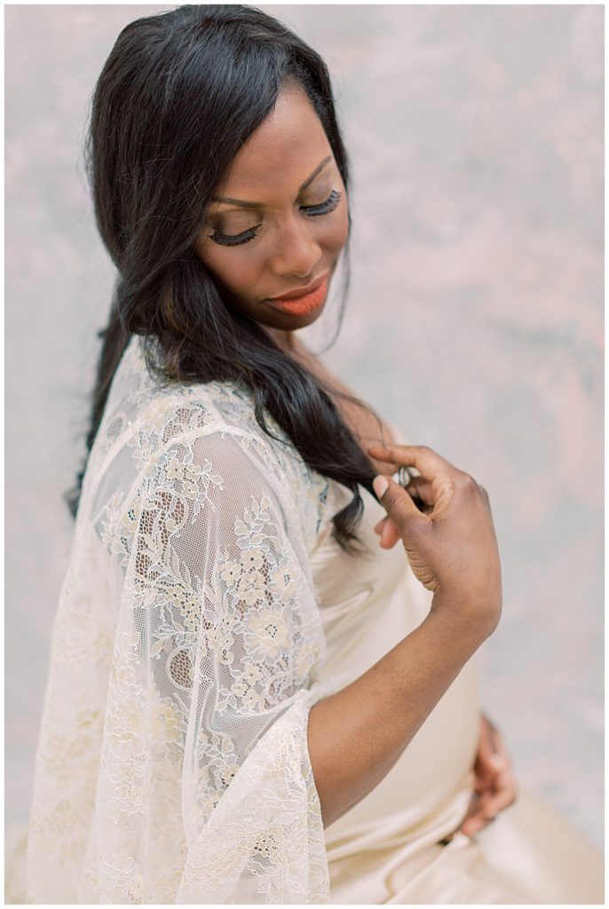 Mother Plays With Her Hair During Dc Maternity Session In Studio