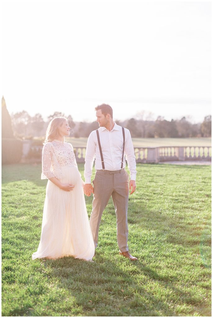 Mother And Father Walk Holding Hands During Washington, D.c. Maternity Session