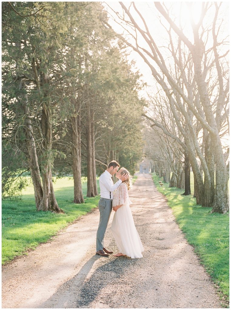 Northern Virginia Maternity Photographer | Couple Stands In Lane At The Great Marsh Estate