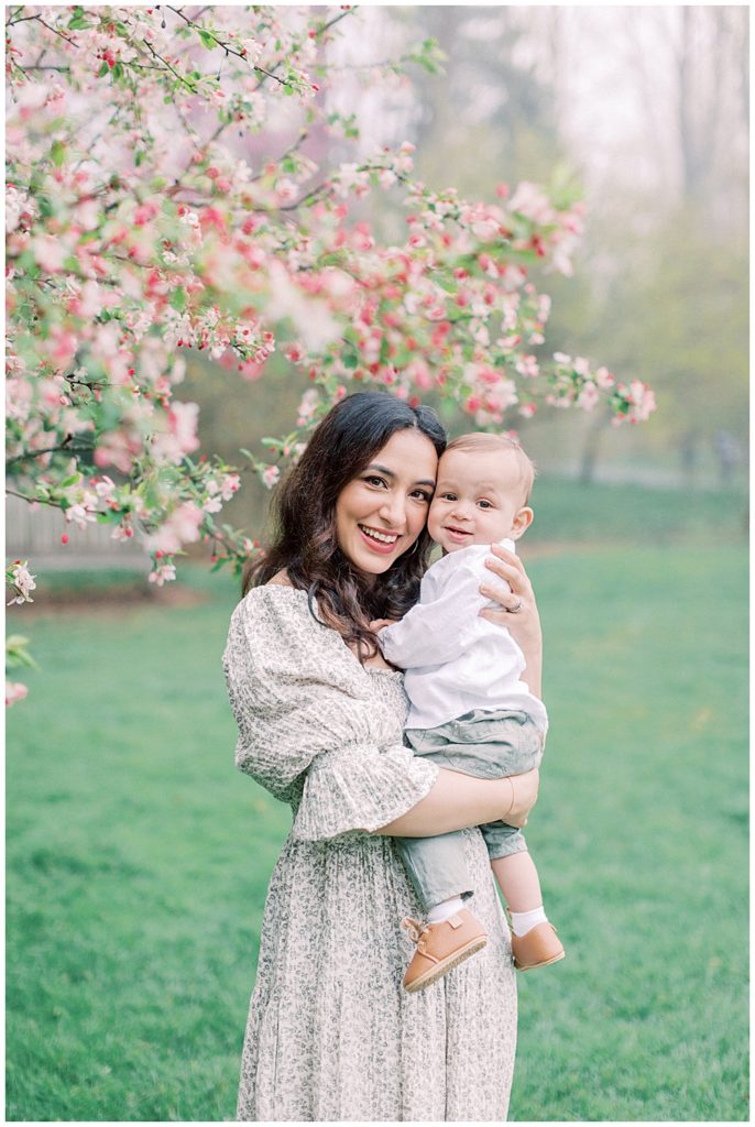 Mother And Baby In Front Of A Cherry Blossom Tree Outside Of Washington, D.c.