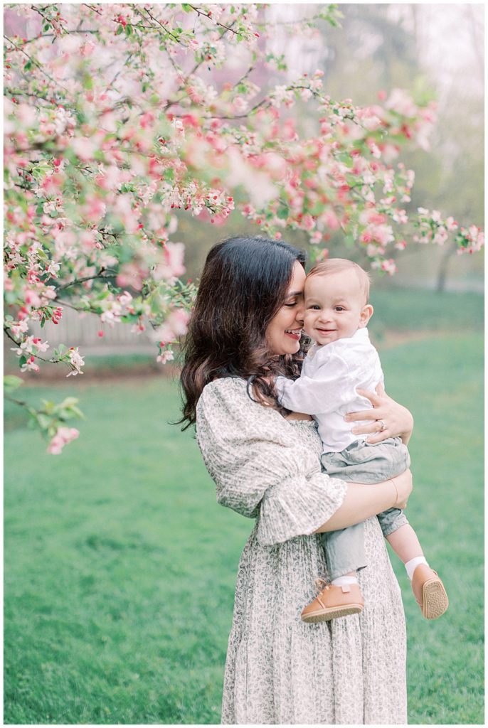 Mother Holds Her Son Closely During A Maryland Family Photo Session In Brookside Gardens.