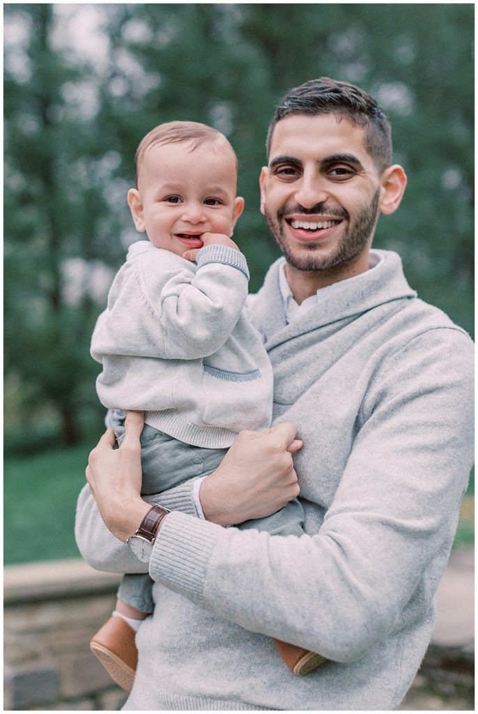 Father Holding Young Son In Brookside Gardens