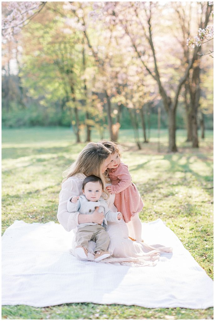 Mother Sits With Her Two Young Children At The National Ar