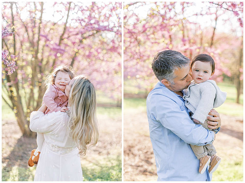 Parents Cuddle Their Young Children At The National Arboretum