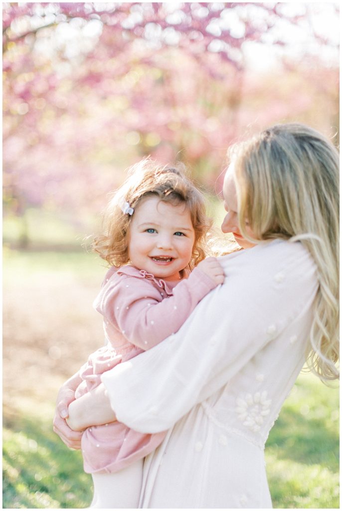 Mom Holds Her Toddler Daughter At The National Arboretum In Washington Dc