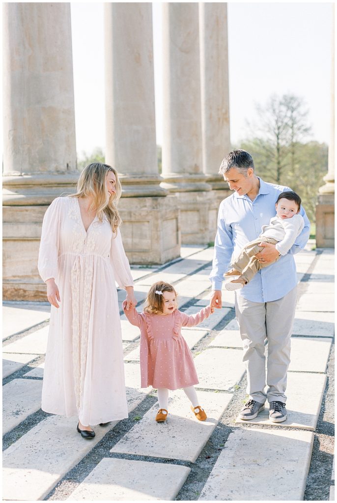 Family Walks Together At The Capitol Columns At The National Arboretum