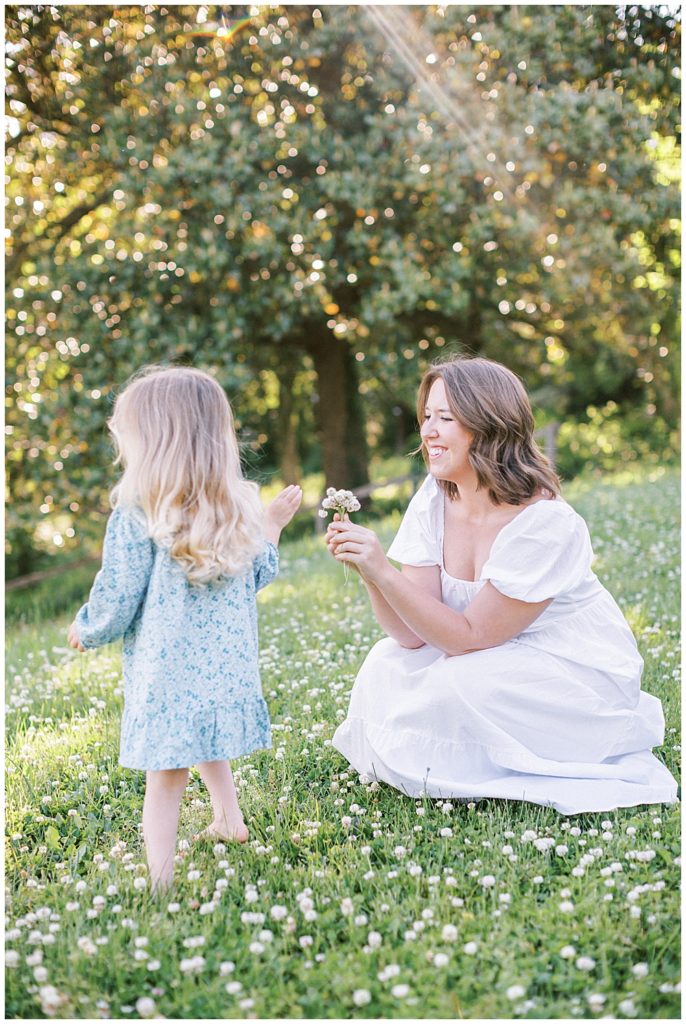 Daughter Gives Her Mother Some Flowers