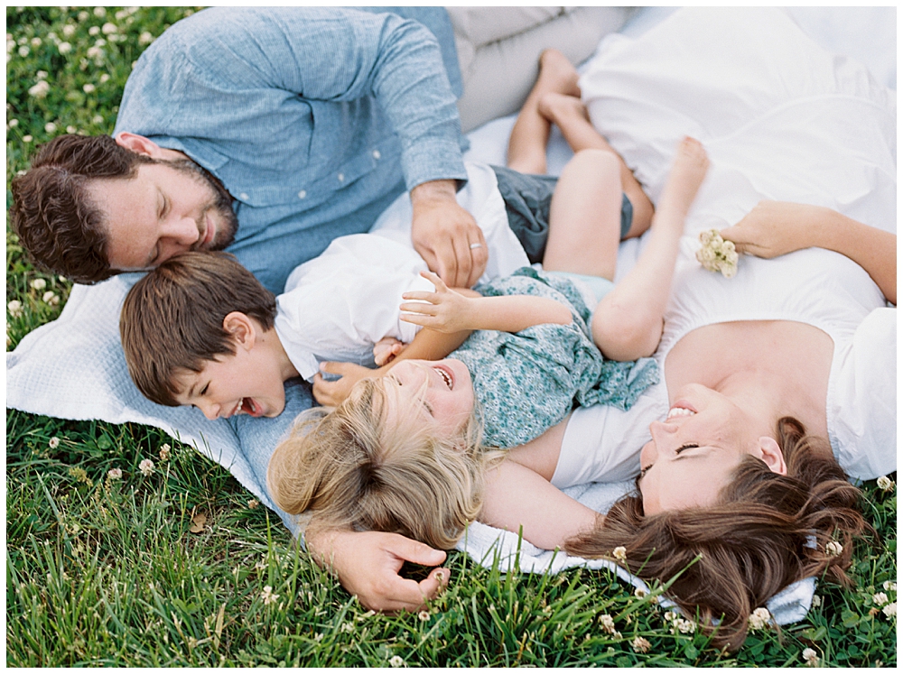 Family Photographers In Maryland | Family Lays Down In Field During Their Family Photo Session