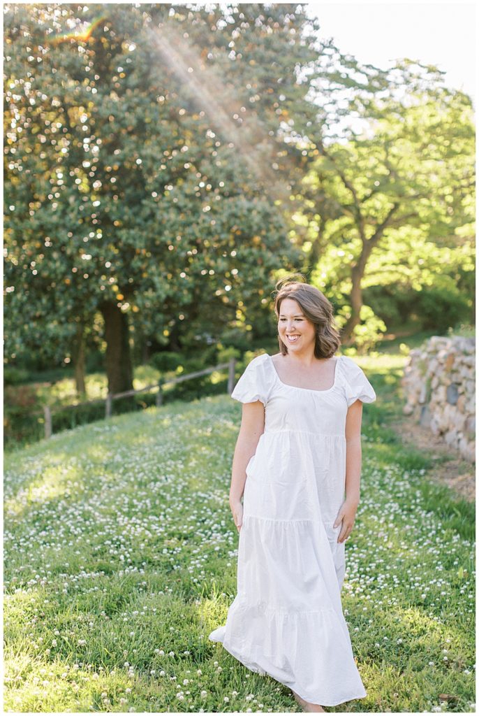 Woman Walks In A Field During Sunset