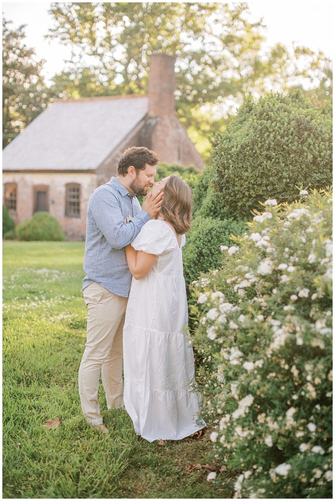 Mother And Father Kiss During Their Family Photo Session