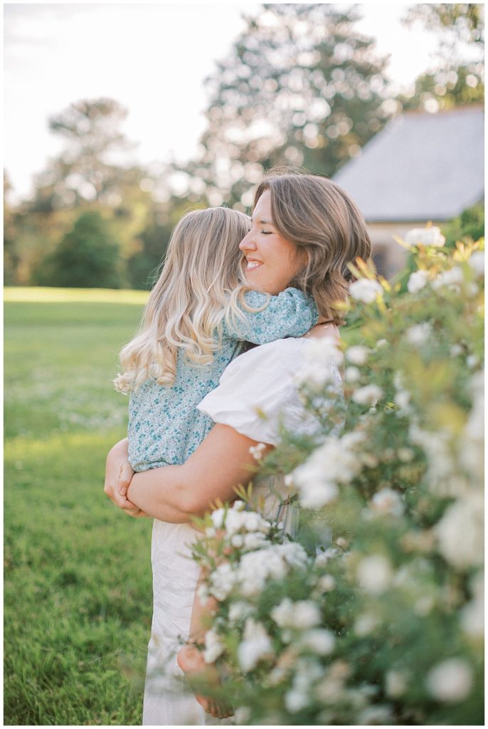 Daughter Hugs Her Mother During Their Maryland Family Photo Session At Mulberry Fields