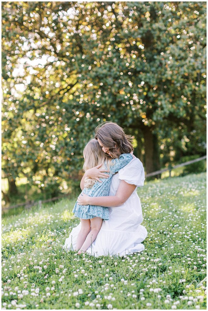 Little Girl Hugs Her Mother