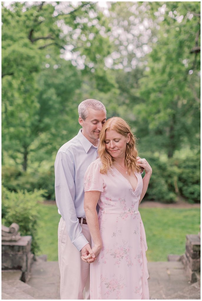 Mother And Father Cuddle Together At Glenview Mansion In Rockville