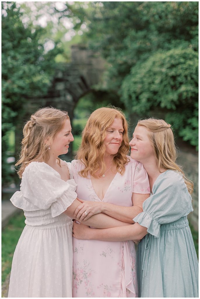 Mother Holds And Looks At Her Two Grown Daughters At Glenview Mansion In Rockville