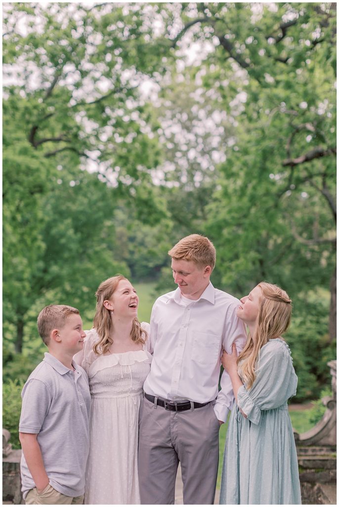 Teen Children Look At One Another During Their Maryland Photo Session