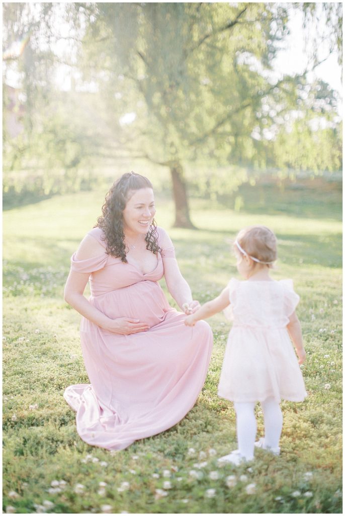 Toddler Girl Gives Her Pregnant Mother A Flower