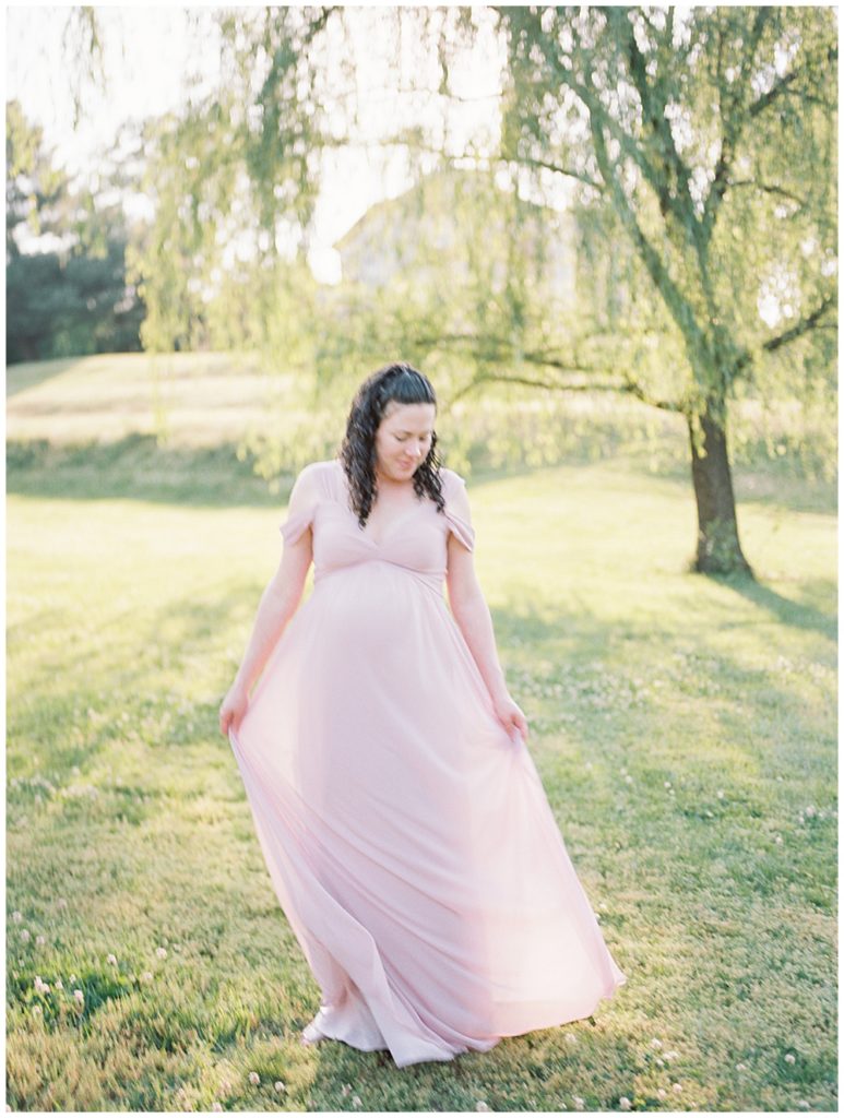 Maternity Photographer Maryland | Pregnant Mother Twirls Her Dress During Her Maryland Maternity Session