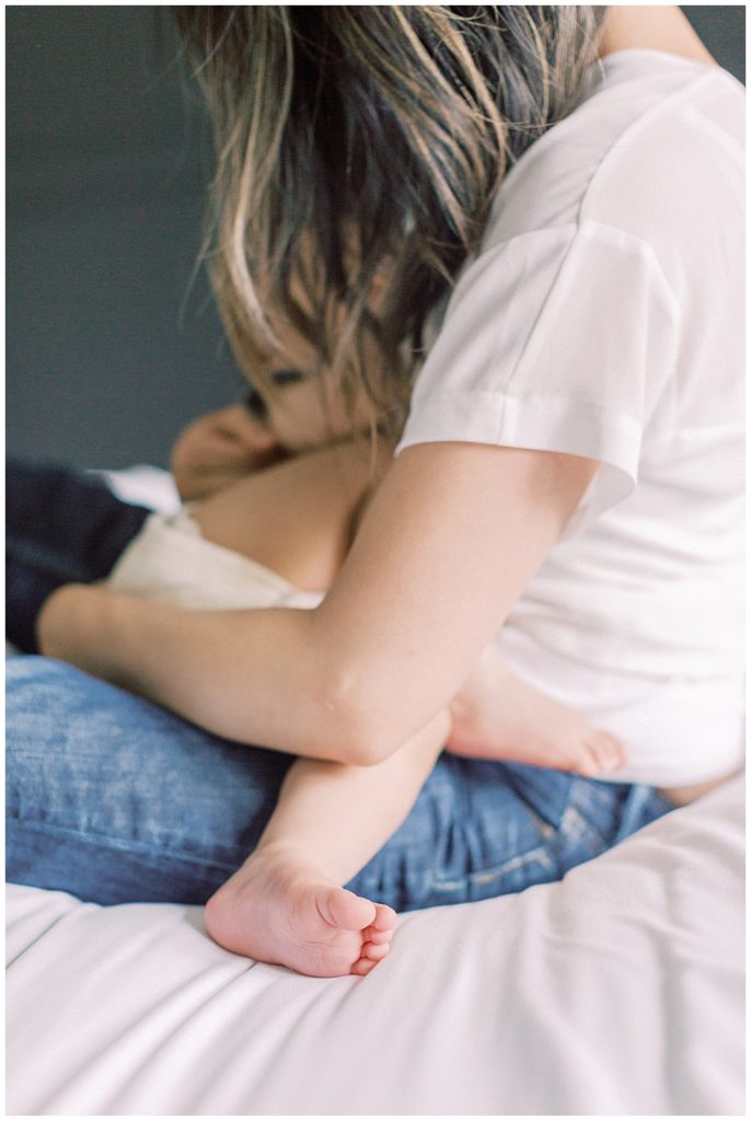 Mother Holds And Nurses Her Son.