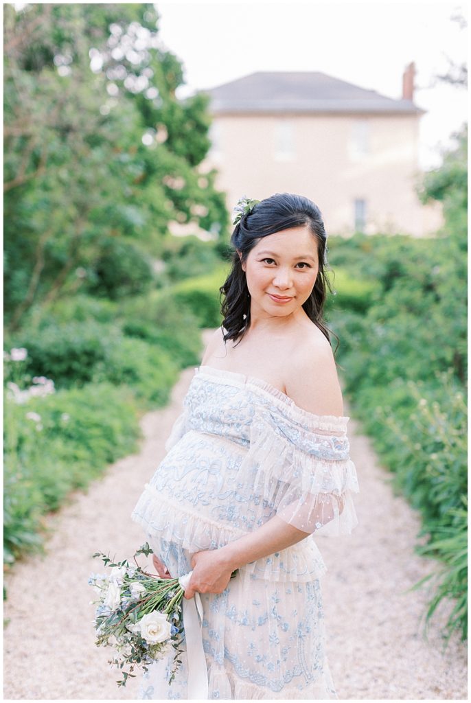 Pregnant Woman Looks Up In Front Of Tudor Place During Dc Maternity Session