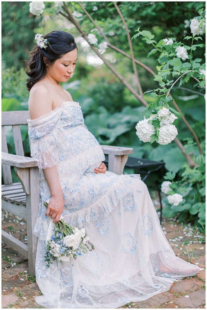 Pregnant Woman Sits On A Bench At Tudor Place In Dc