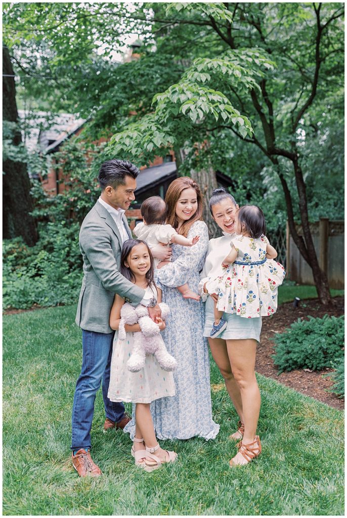 Family Surrounds Their One Year Old Daughter During Her First Birthday Celebration