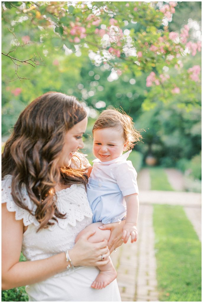 Mother Smiles At Her Toddler Son During A Dc Family Session At Tudor Place