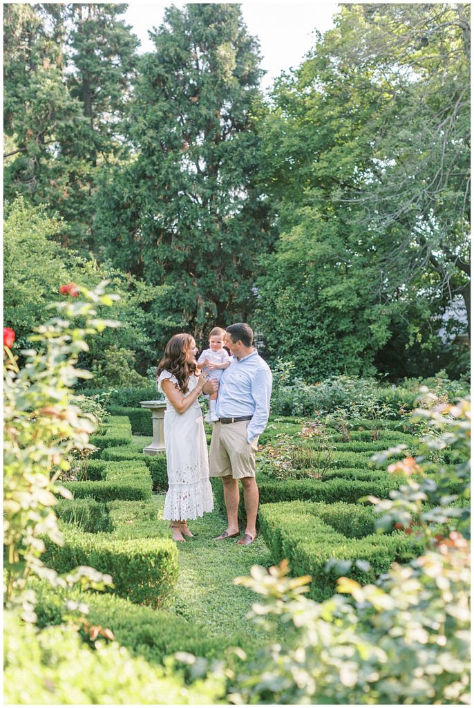 Parents Play With Their Young Son In The Gardens At Tudor Place