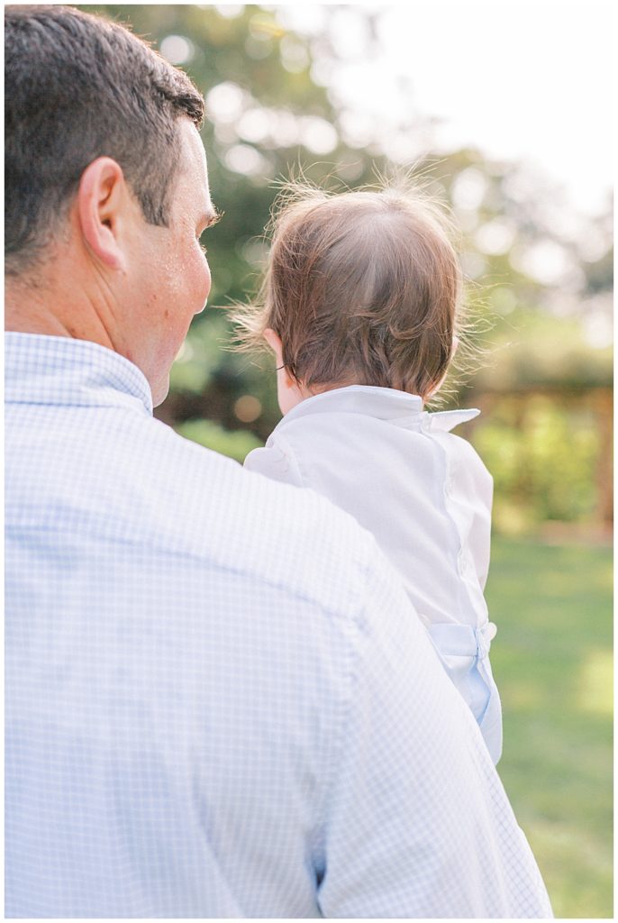 Father Holds His Young Son