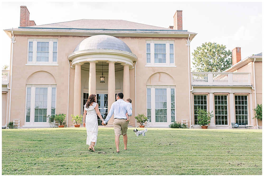 Family Walks Together Outside Of Tudor Place Manor