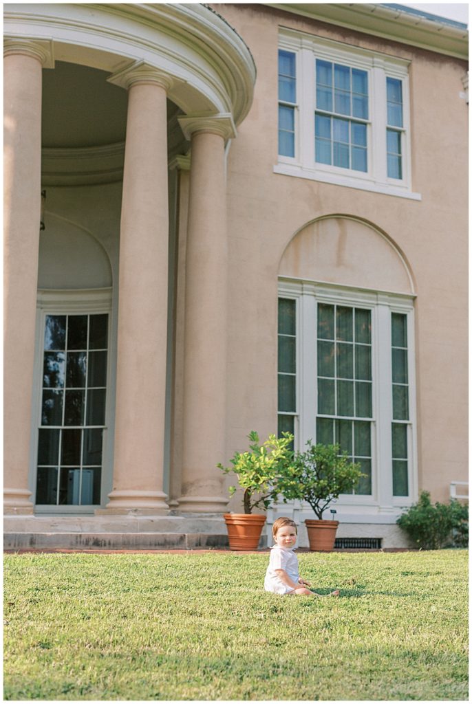 Baby Boy Sits In Front Of The Pillars At Tudor Place