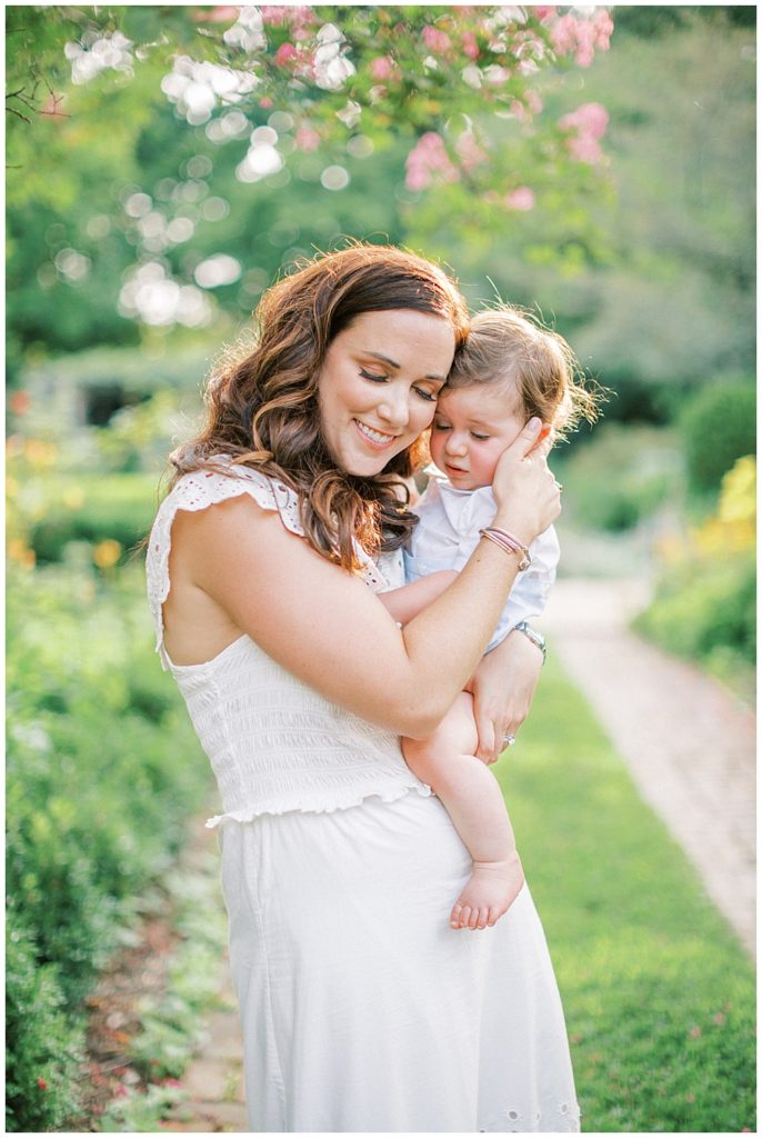 Mother Holds Her Son Close To Her And Closes Her Eyes