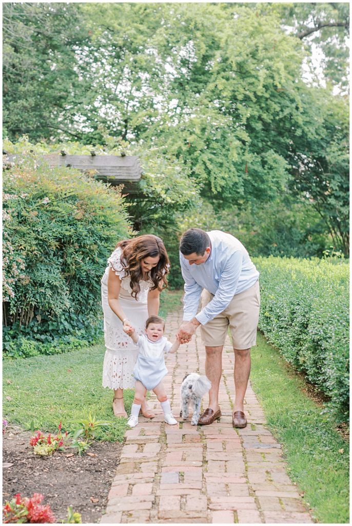 Parents Walk With Their One Year Old Boy