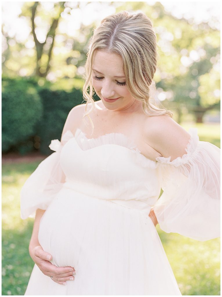 Nova Maternity Photographer | Pregnant Mother Stands With Her Hand Below Her Belly For Her Dc Maternity Session