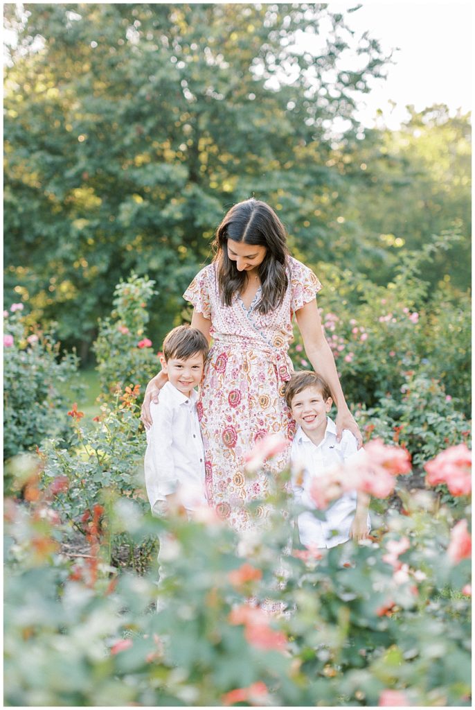 Mother Looks Down At Her Two Young Sons In The Bon Air Rose Garden