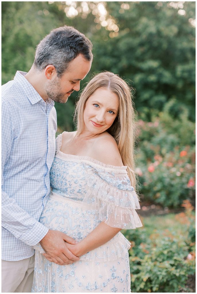 Expecting Mother Looks Romantically At The Camera During Her Maternity Session In Arlington Va