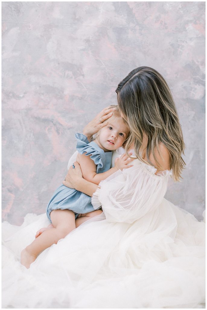 Pregnant Mother Holds Her Little Girl Against Her