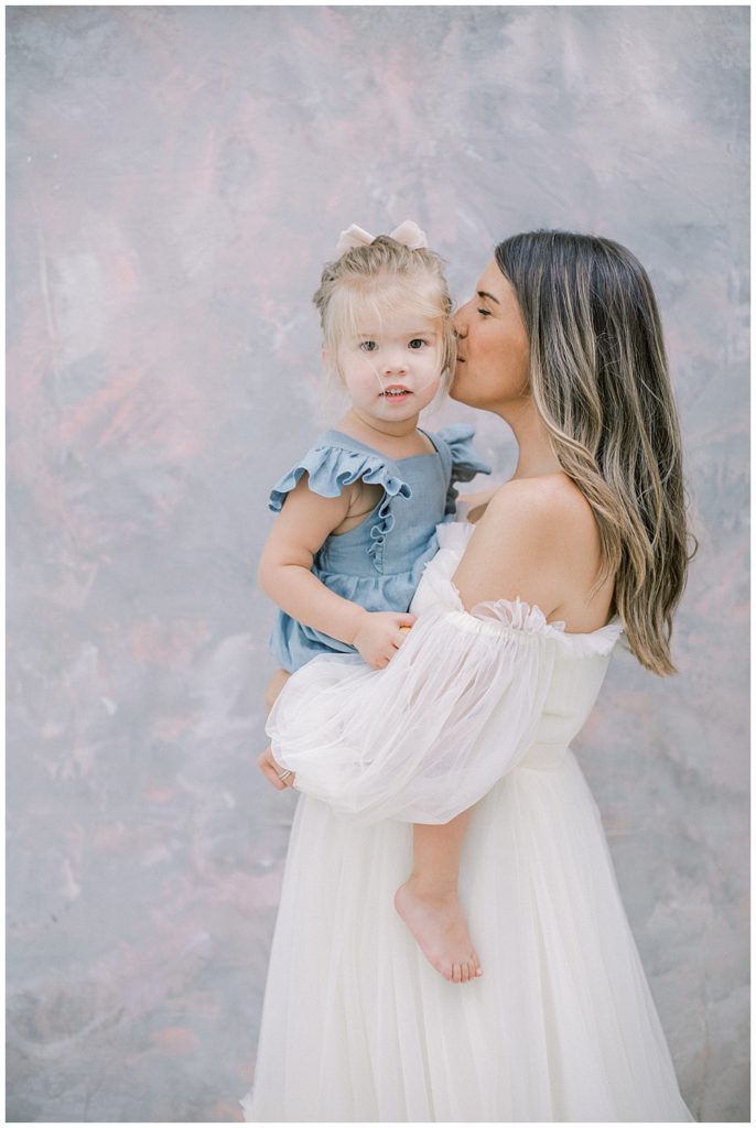 Mother Kisses Her Daughter's Cheek